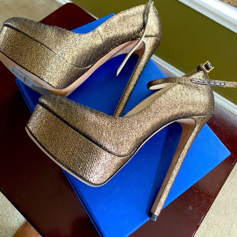 Never worn Jimmy Choo Pumps with Straps